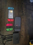 Nintendo Switch Gray Console With 4 Joy Con, Case, And Lets Go Eevee. Fixed Price $175.00.