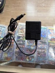 Sega Genesis Power Adapter MK-2103. Fixed Price $18.00.
