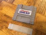 Nintendo Super Game Boy Snes Cartridge 1994 SNS-027 W/clear Cover. Fixed Price $35.00.