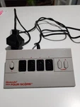 Nintendo Four Score Player Controller Adapter NES-034A Authentic Tested. Fixed Price $40.00.