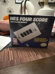 Nintendo Nes Four Score Adapter Controller 4-PLAYER Compatible, Model -034. Fixed Price $125.00.