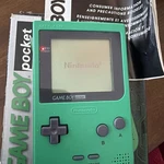 Nintendo Game Boy Pocket Green Handheld Console System With Box Manual. Fixed Price $139.00.