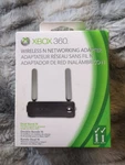 Microsoft Xbox 360 Wireless Networking Adapter Model 1398 - New / Sealed. Fixed Price $49.99.