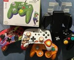 Video Game Controllers, Charging Station, And Mini Switch Dock Bundle Lot. Fixed Price $250.00.