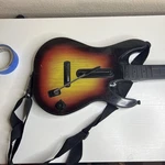 Guitar Hero Red Octane Sunburst Controller PS2 No Dongle Missing Battery Cover. Fixed Price $23.74.