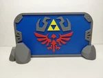 Zelda Hylian Shield Nintendo Switch 2 Dock Cover Stand Project Mayhem Designs. Fixed Price $24.99.