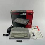 Vintage Atari 65XE Personal Computer W/ Manuals, Power Supply, & Bow Vgc. Fixed Price $269.99.