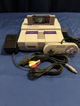 Super Nintendo 1 Controller, Mario Game, All Cables Included. Fixed Price $300.00.