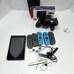 Nintendo Switch Console W/ Joy-con Controllers, Straps, Dock, Grip. Fixed Price $135.00.