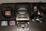 Sega Genesis Model 2 - Game Bundle 8BITDO Wireless M30 Power Cable. Fixed Price $110.00.