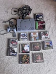 Sony Playstation PS1 SCPH-7001 Console Bundle W/ Controller, Memory Card & Games. Fixed Price $150.00.