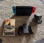 Nintendo Switch 32GB + Zelda Breath Of The Wild Red/blue Joy Cons Pre-owned. Fixed Price $164.99.