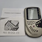 1992 Saitek Pro Bridge 310 Electronic Handheld Portable Game System &books Works. Fixed Price $39.95.